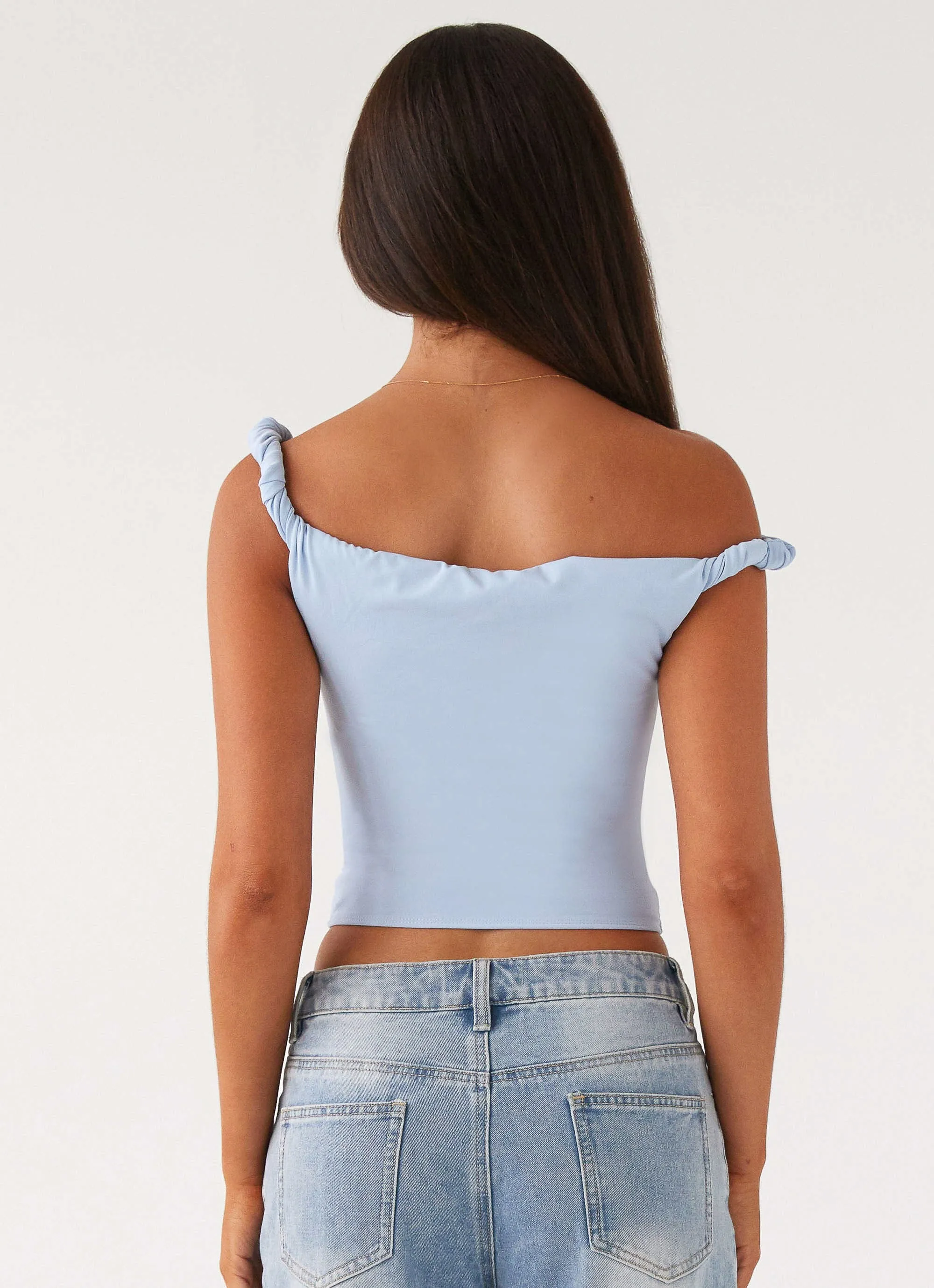 Four Way Stretch Fabric Curved Hem Solace Soul Twist Shoulder Top - Baby Blue